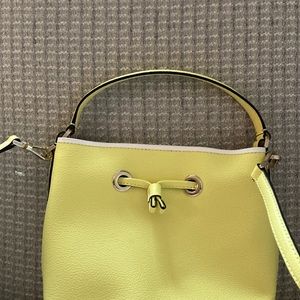 Kate Spade handbag. New without tags. Never used. Yellow.